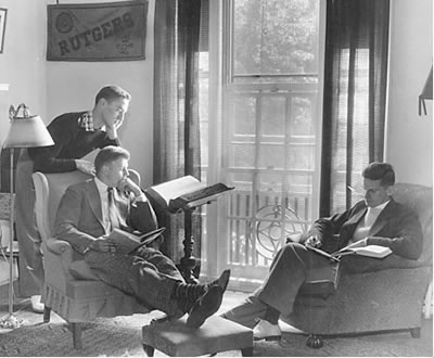 Striking a studious pose in a dorm room